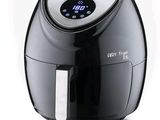the air fryer is black and white with a digital clock on it