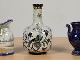 three vases sitting on a table next to each other