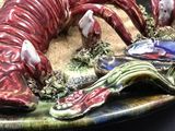 a plate with a lobster on it on a table