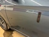a close up of a car door with a sticker on it