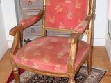 a chair that is sitting on a rug in a room