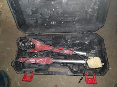 a tool in a case that is sitting on the floor