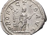 a silver coin with an image of a man holding a sword