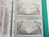 three different bills in a binder on a table