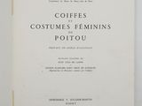 a close up of a book on a table with a white background