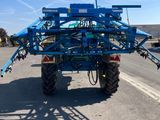 an image of a tractor that is parked on the side of the road