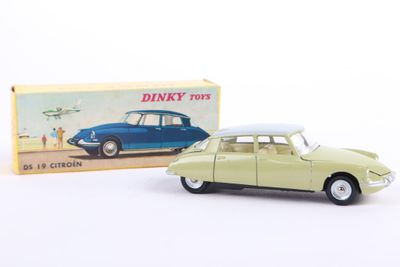 an image of a toy car with a box on a white surface