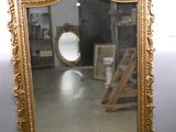 a mirror that is sitting on the floor in a room