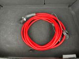 a red hose in the trunk of a car