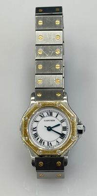 an image of a lady ' s watch with roman numerals on the bracelet