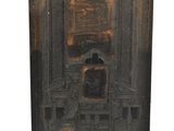 an old wooden box with a picture of a man sitting in a chair