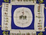 an image of a blue and white table cloth with a picture of a group of people on it