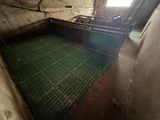 a green floor in the middle of a dirty room