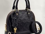 Sac à main Louis Vuitton en cuir noir à motif Monogramme, avec finitions dorées