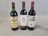 three bottles of wine sitting next to each other on a table