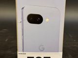 a close up of a box with a phone in it on a table