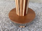 a wooden table with a wooden top and a metal base