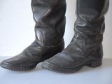 a close up of a pair of boots on a white surface