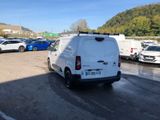 a white van that is parked in a parking lot