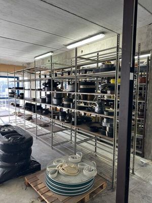 a large room with a lot of pots and pans on the shelves