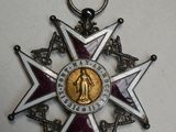 une image représentant une médaille entourée d'un ruban, avec une médaille au centre