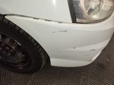 a close up of a car ' s headlight and front bumper