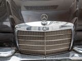 a close up view of a mercedes car ' s front grill