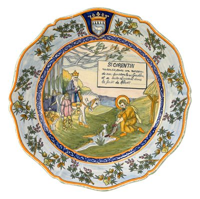 une assiette avec l'image d'un homme et d'un chien