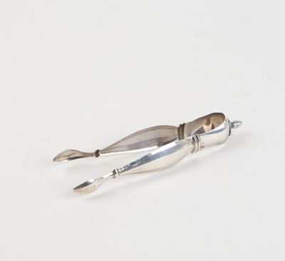 a knife that is laying on a white surface