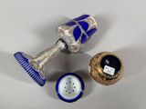 a blue and white vase and a blue and gold vase