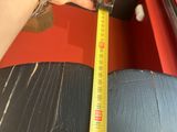 someone is measuring the height of a chair with a tape