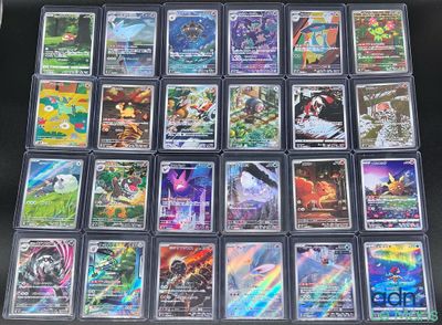 beaucoup de cartes pokemon sur la table