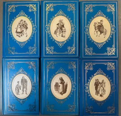six blue books with pictures of people and animals on them