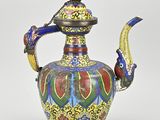 an image of a colorful tea pot with a bird on it