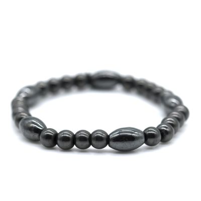 a close up of a black beaded bracelet on a white background