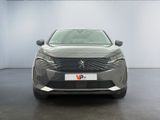 the front view of a grey car in a showroom