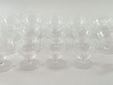 a lot of empty wine glasses sitting on a table
