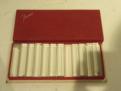 a red box that has a lot of silver bars in it