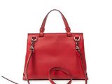 a red handbag on a white background with a strap