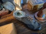a pair of shoes with a magnifying glass on a table