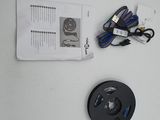 a picture of a remote control with wires attached to it