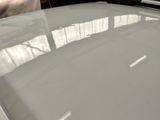 a close up of a car ' s hood with the hood down