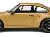 yellow porsche 9113 with black rims parked on a white surface