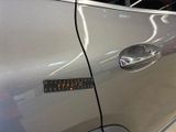 a close up of a car door handle with a sticker on it