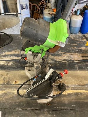 someone is using a circular saw to cut a piece of wood