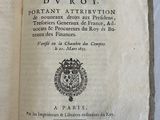 an old book that is open on a table