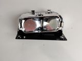 a silver object with two red lights on it