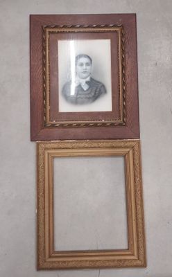 a picture of a woman that is hanging on the wall
