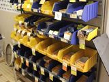 many bins on the shelves in the store