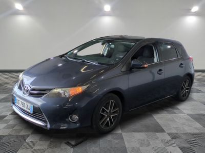 the toyota sienna is parked on a checkered floor in a garage